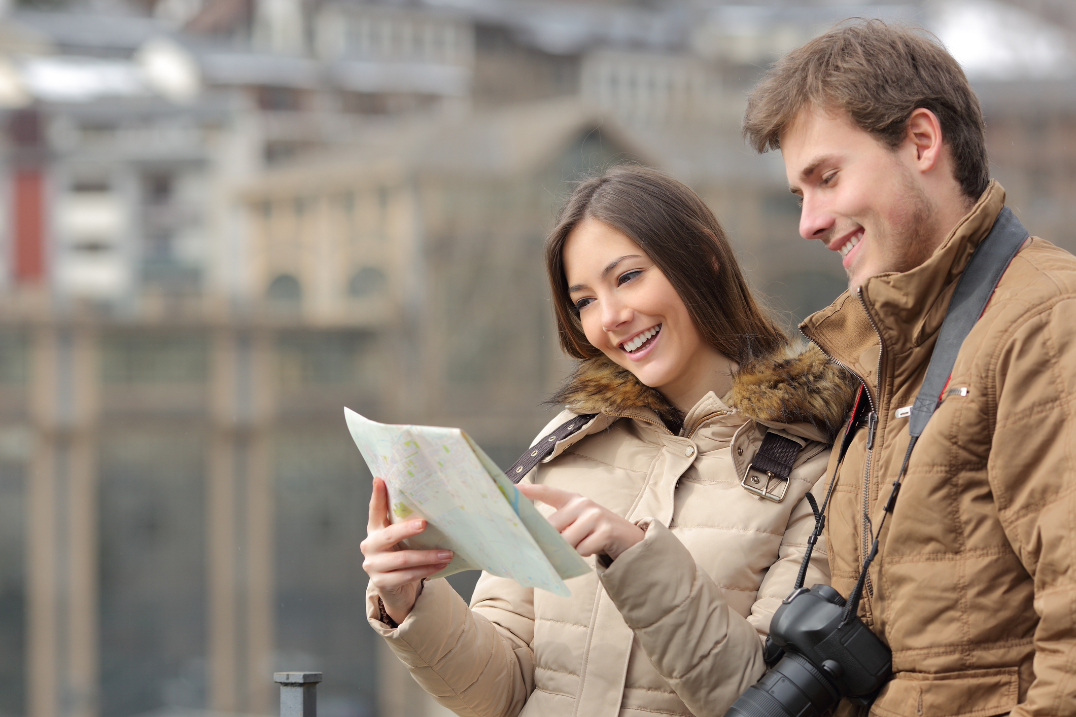 Image of couple using a travel guide 